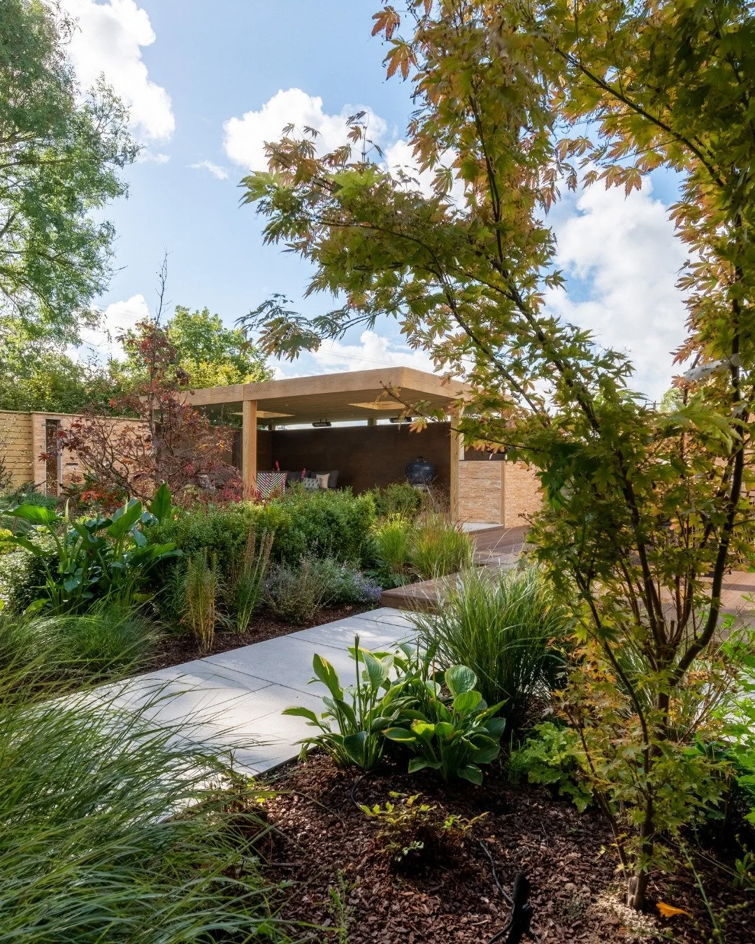 Taking a courtyard layout and giving it serious architectural structure

We wanted this build to work as an evening retreat. The timber pavilion is kitted out with built-in heaters and ambient downlights, linking directly to the main dining deck via 