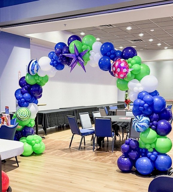 Organic balloon arch with blue and green balloons in Metro Detroit