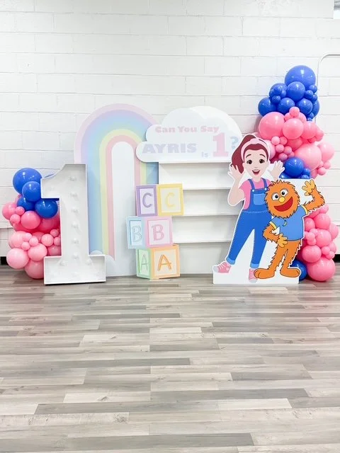 First birthday balloon setup with custom backdrop in Westland, MI