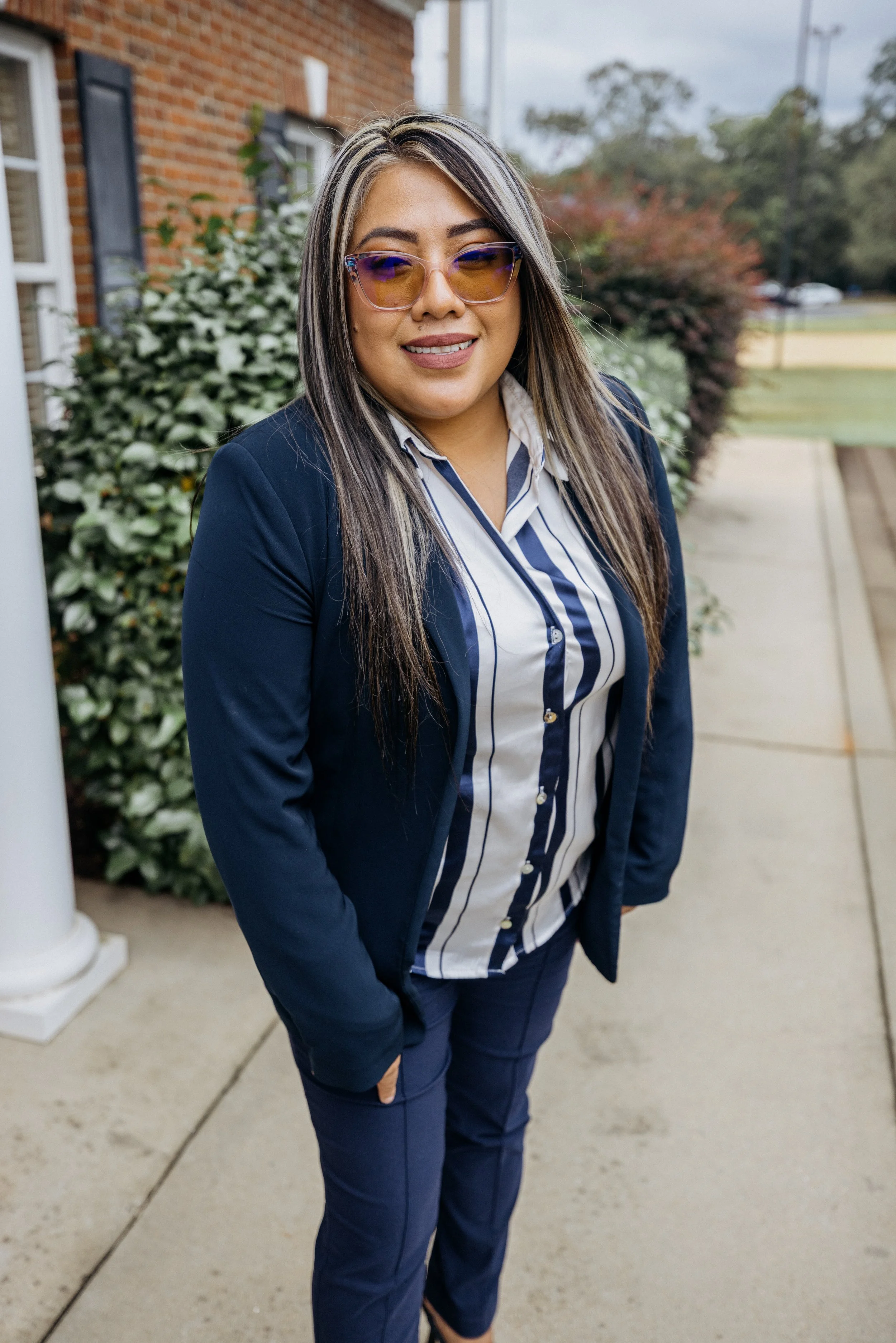 Gray silhouette of a person, with a circular head and rectangular shoulders.