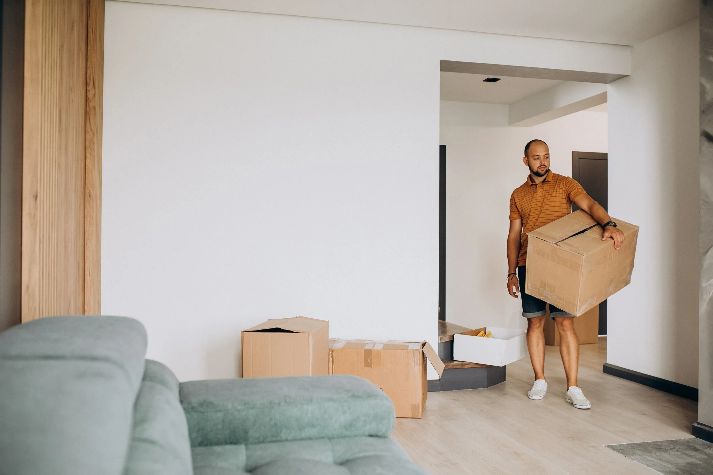 young-man-moving-into-new-house.jpg