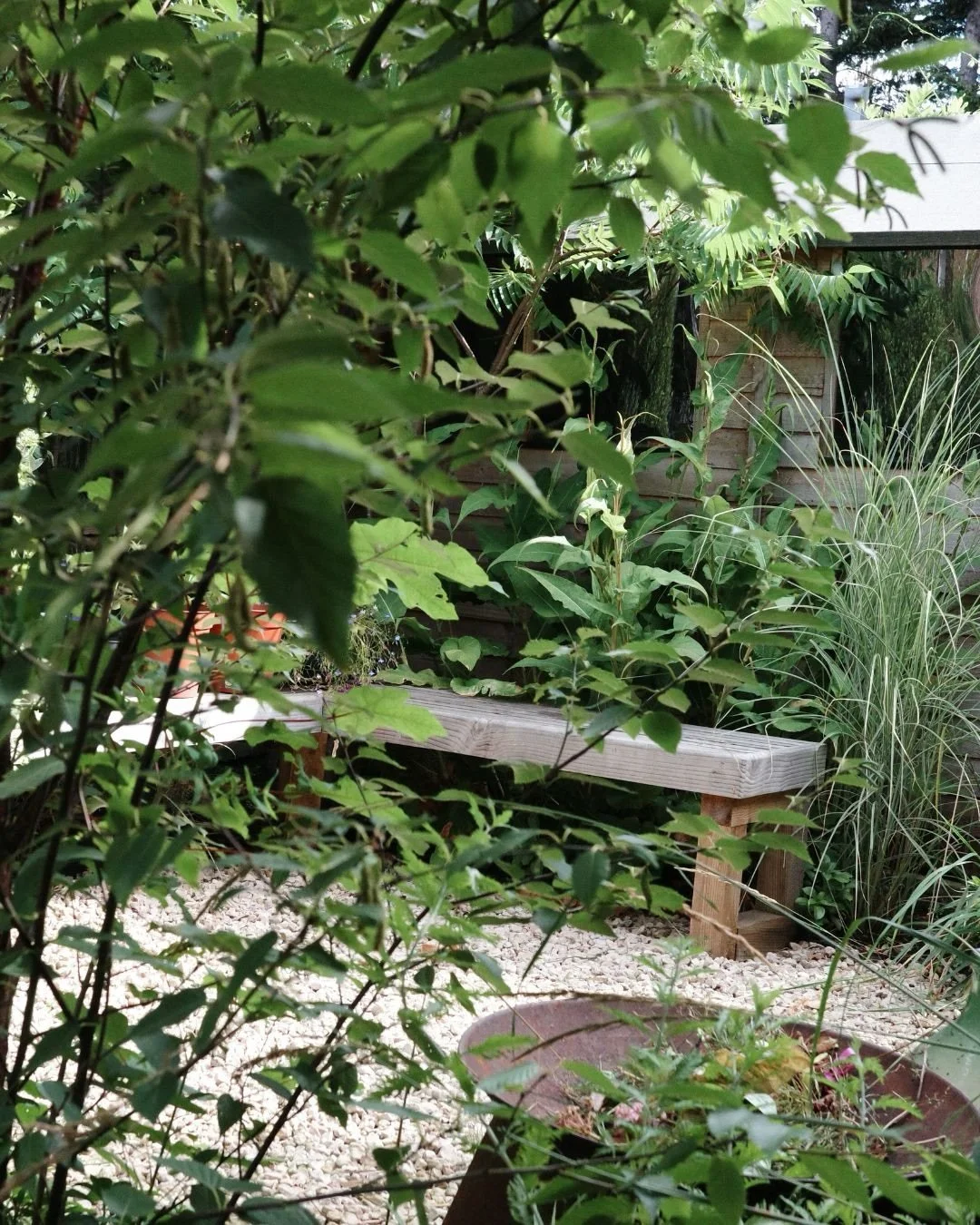We layered this planting scheme to grow into itself over time. Trees now soften sightlines and add a sense of mystery as you move through the garden, and we tucked in a secret seating area behind the greenery, giving the grown-ups somewhere to disapp