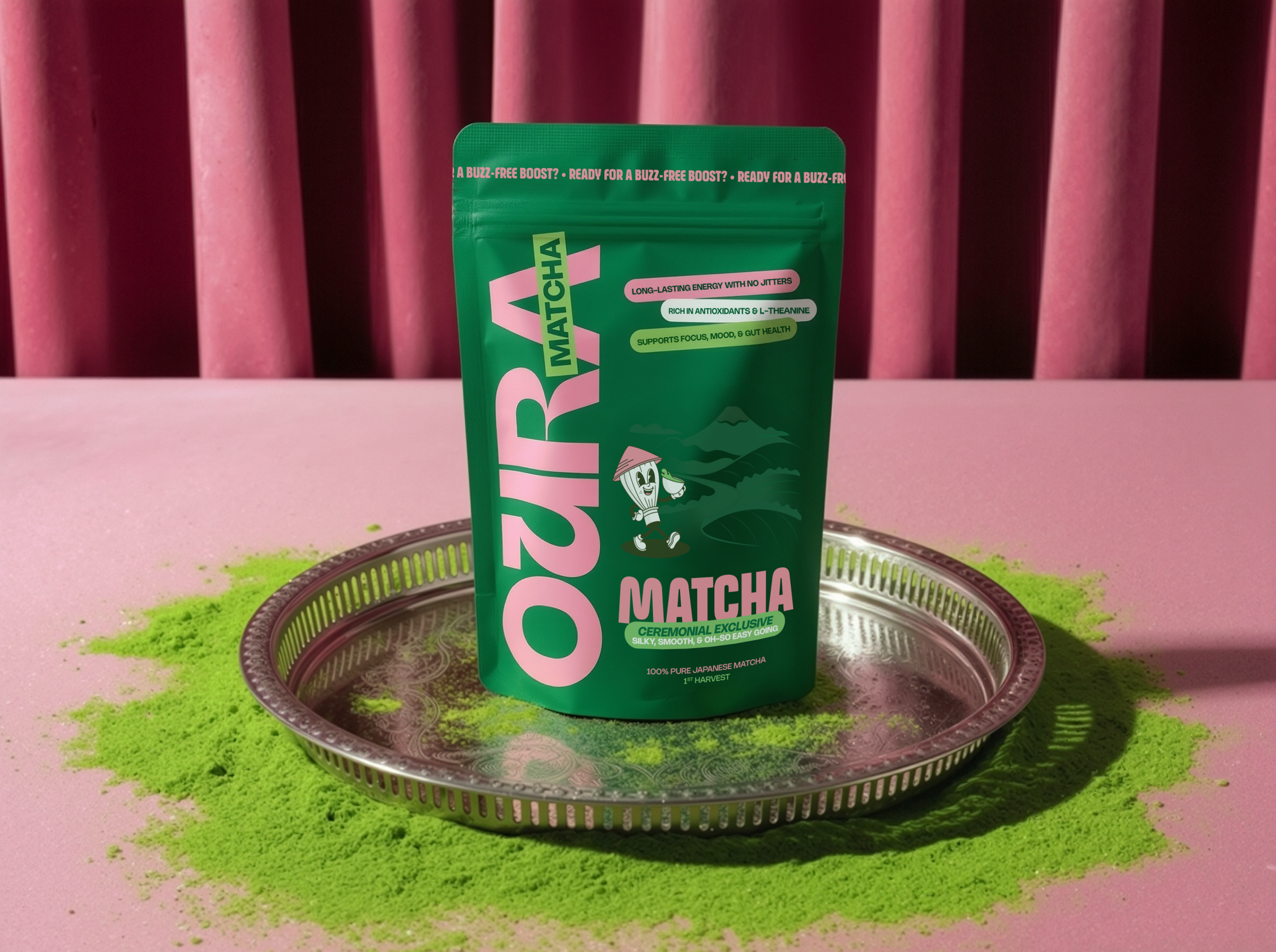 A green package of matcha powder standing on a metal tray, with green and pink powdered matcha spilled around it on a pink surface and pink background.