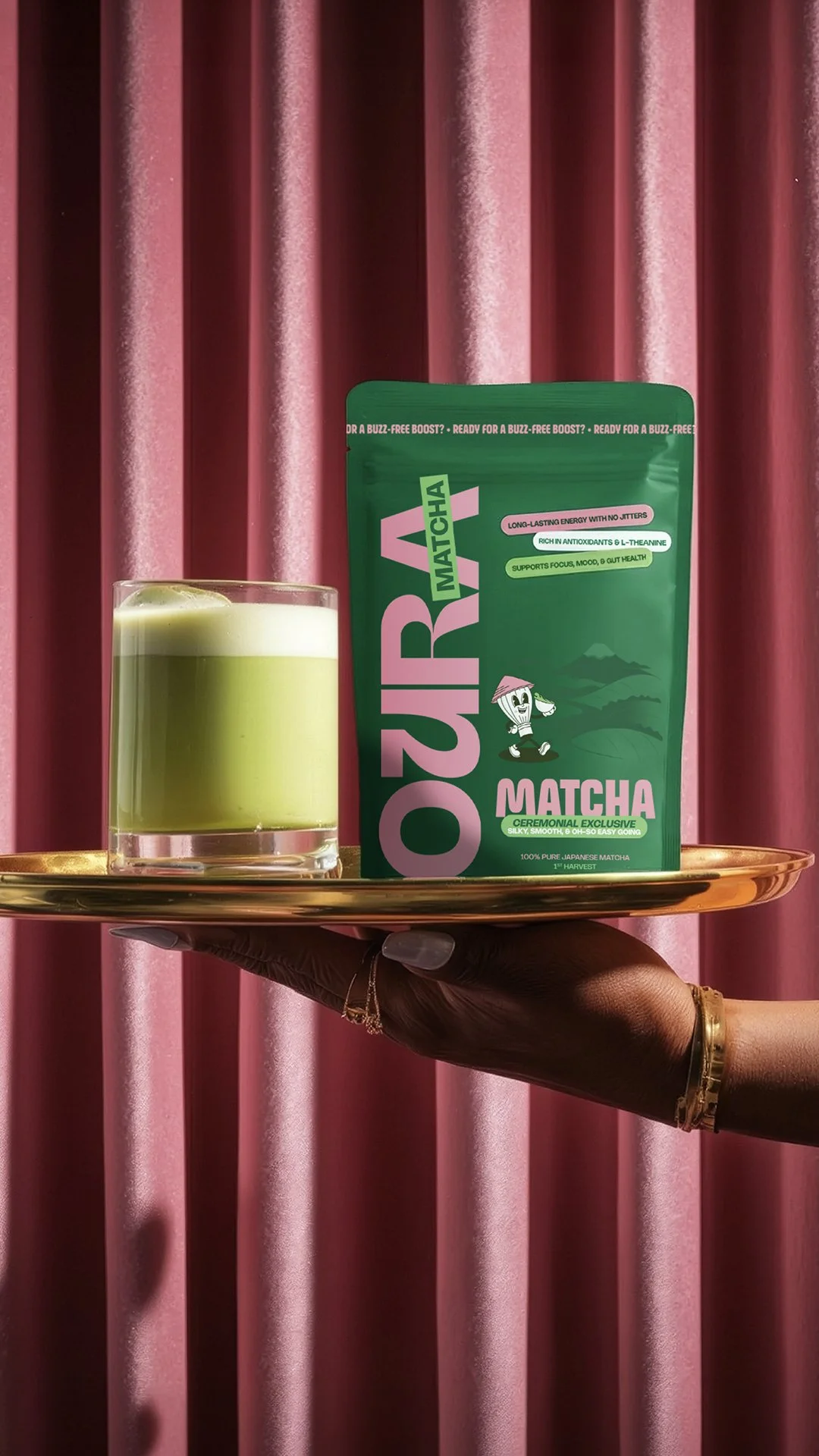 Oura Matcha Pouch sits alongside matcha latte on gold tray