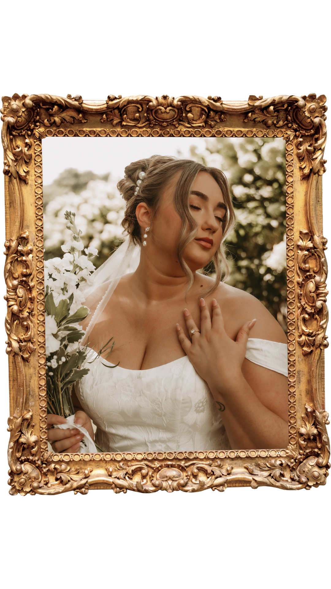 A woman in a white dress, holding a bouquet of white flowers, with her eyes closed and hand on her chest, framed by an ornate gold picture frame.
