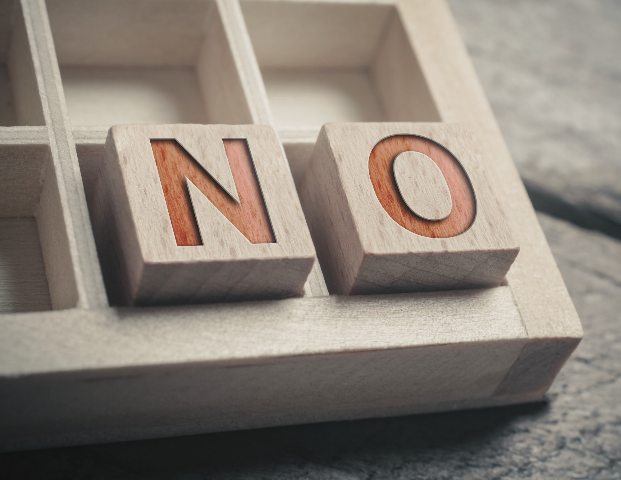 an image of two wooden blocks that spell out the word no