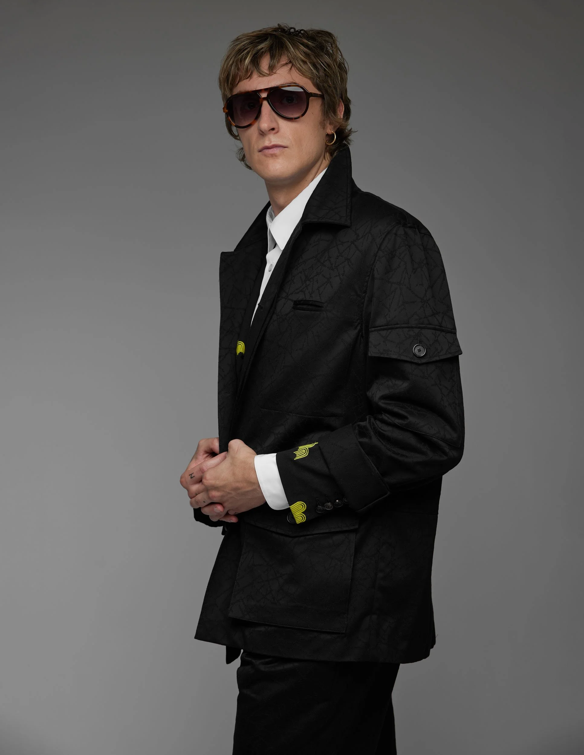 Oumlil_SS24_embroidered_vest_under_black_jacket_2.jpg