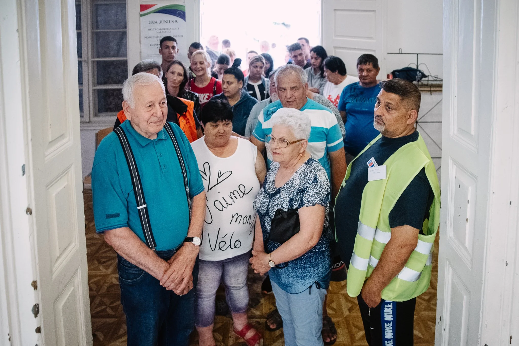 Voters wait to enter the polling station.