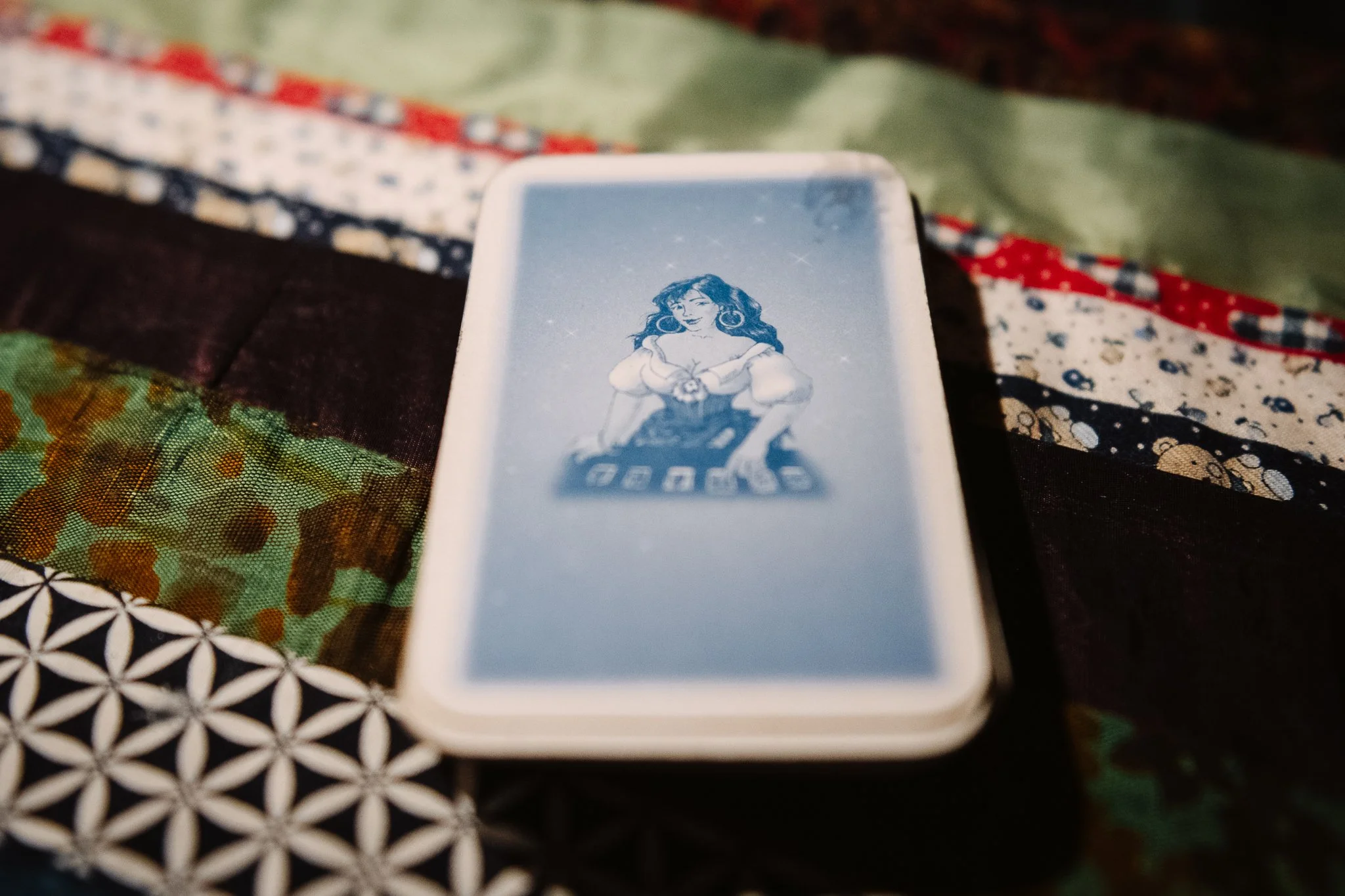 A deck of gypsy cards. Lóri says the 36-card gypsy card is more direct than the tarot, it tells you what's wrong in a very straightforward way. The main question is where the Queen of Hearts is situated when the cards are spread on the table.