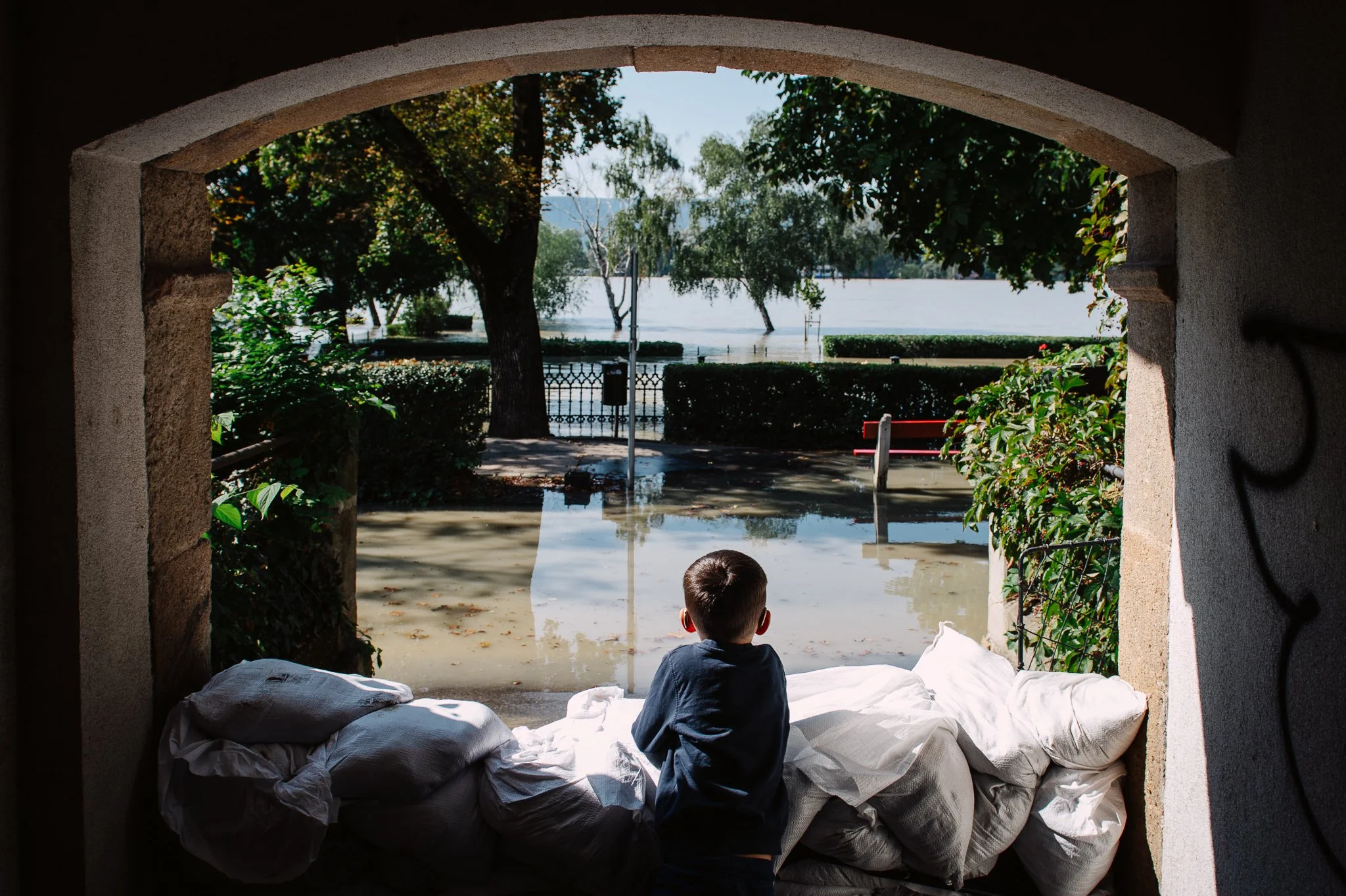 A hearing-impaired child looks at the Danube in the centre of Vác. Teachers from the Cházár András Multipurpose Public Education Institution brought some students to watch the flood together.