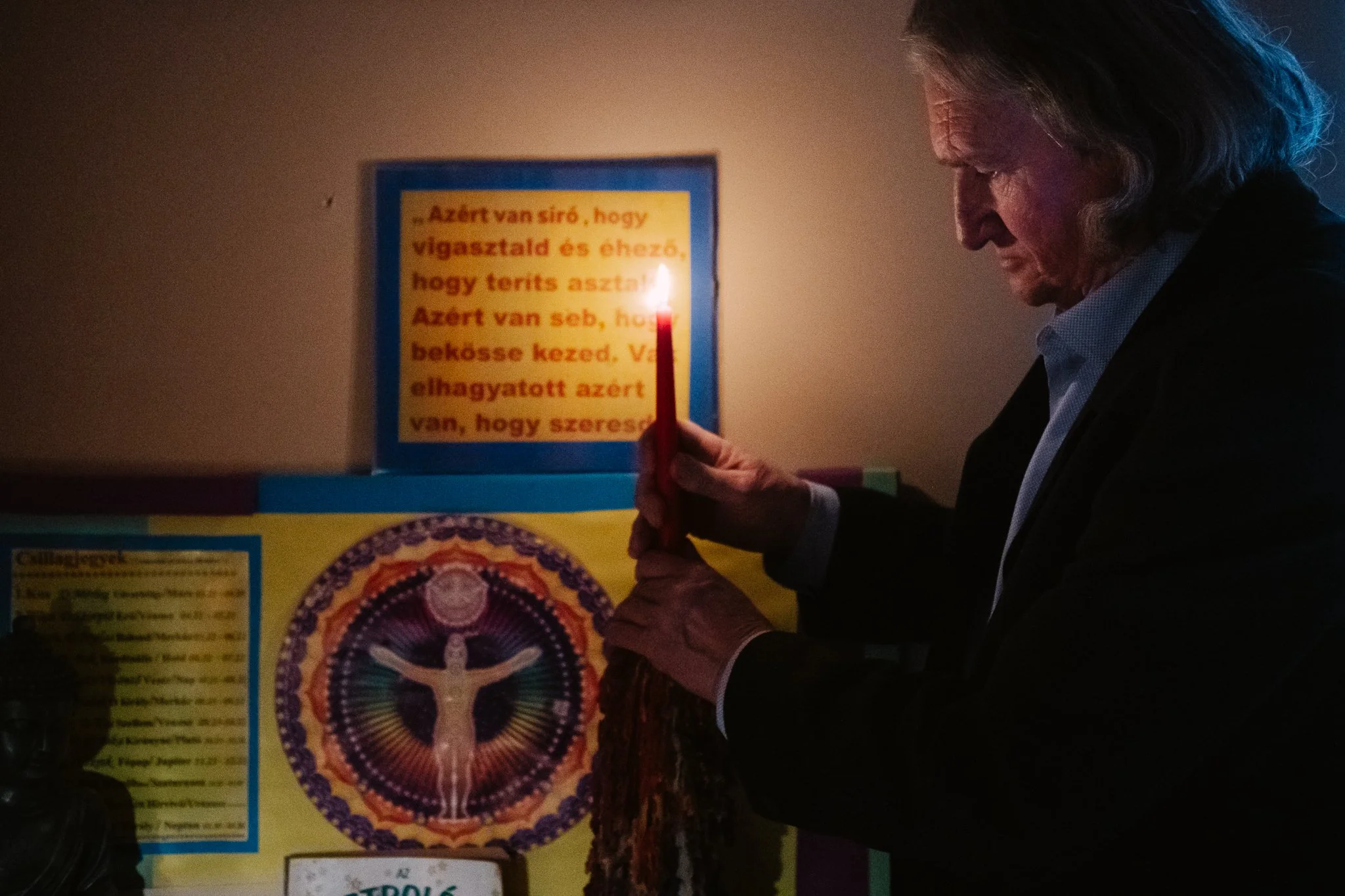 Lóri lights a candle. Twilight sharpens the inner vision.