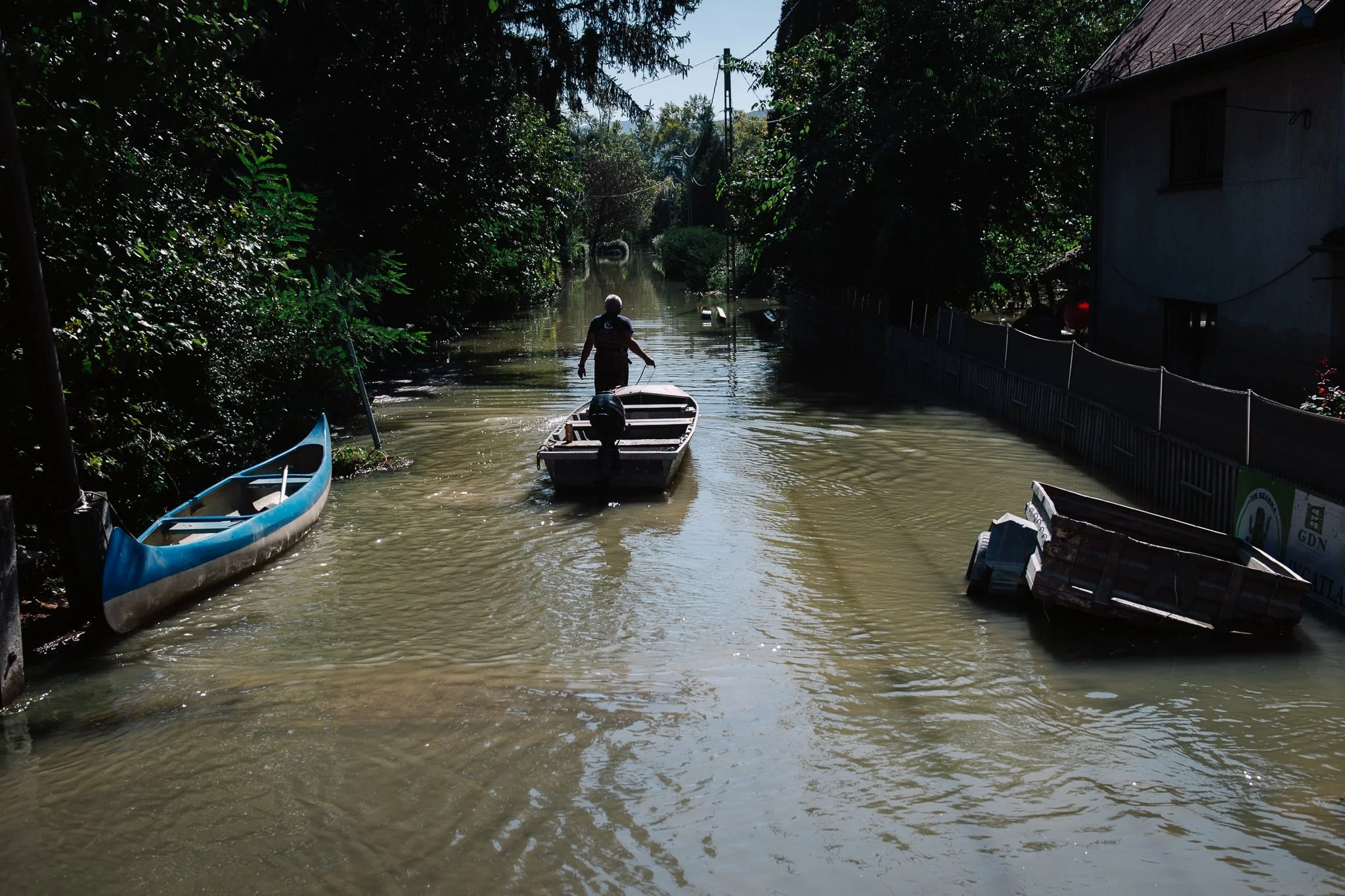 A man in a flooded street of Verőce heading towards his house to save some of his objects on 22 September 2024.