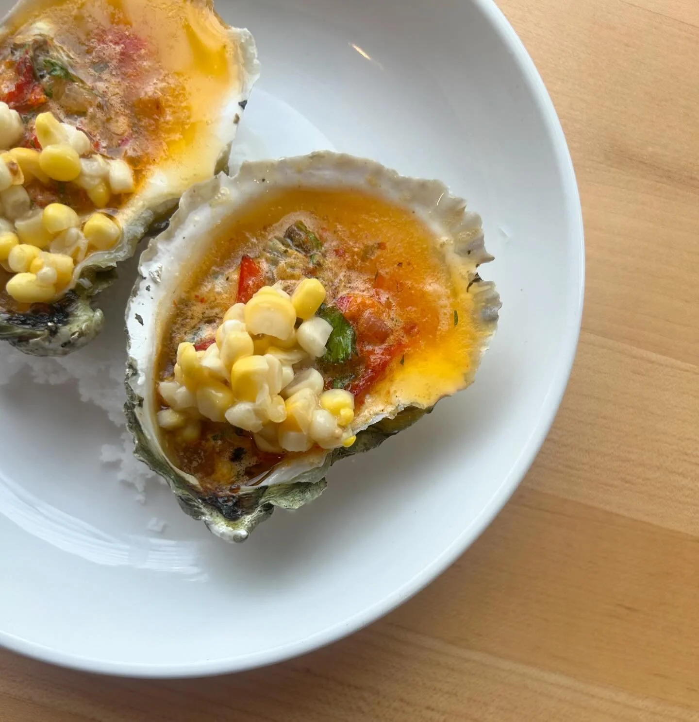 Roasted oysters, Calabrian chili butter, pickled corn.