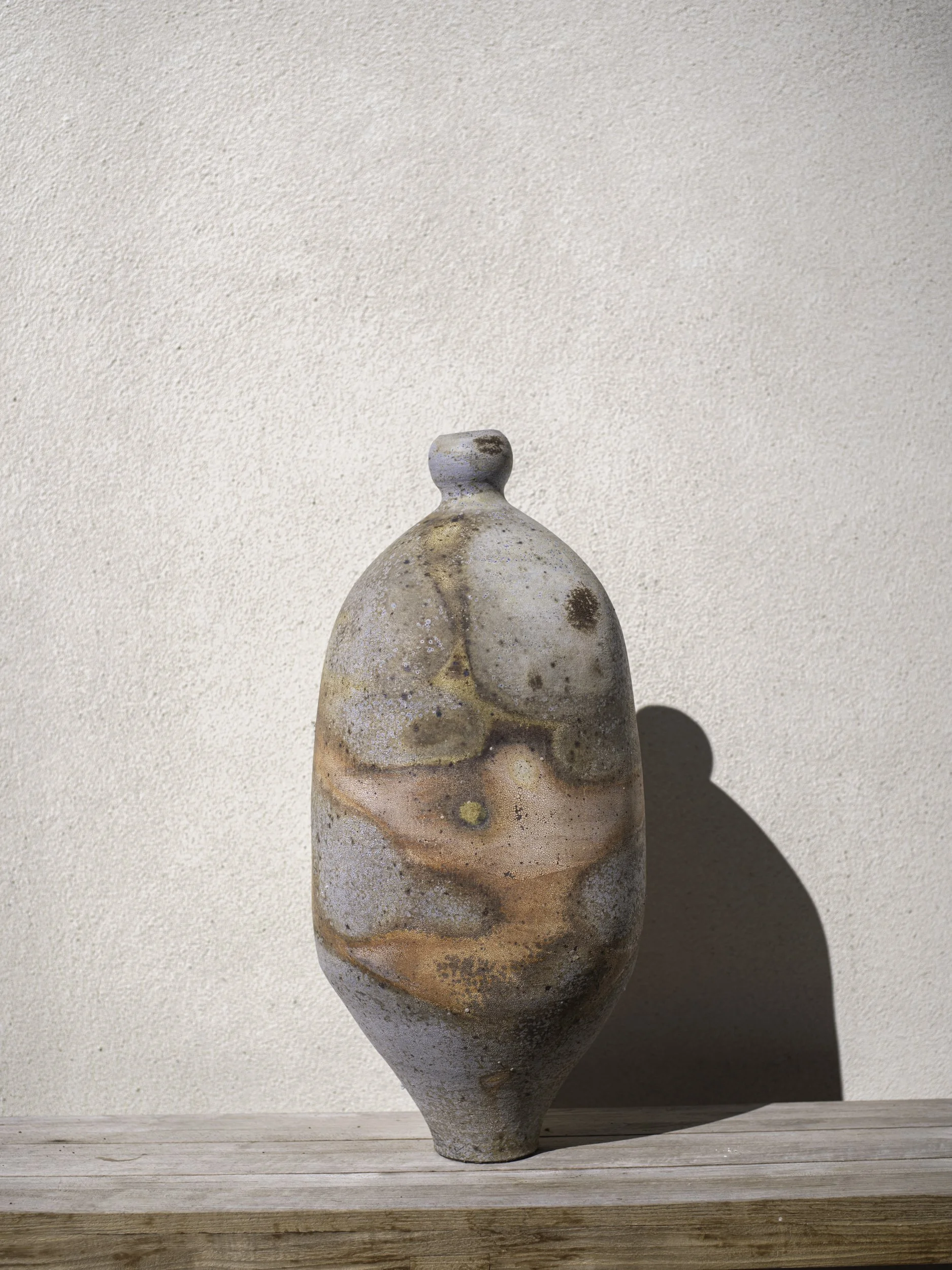 LOGAN WANNAMAKER  
Tall Necked Bottle (2025)  
13” x 13” x 31”  
Stoneware with New Zealand porcelain slip  
$4,800