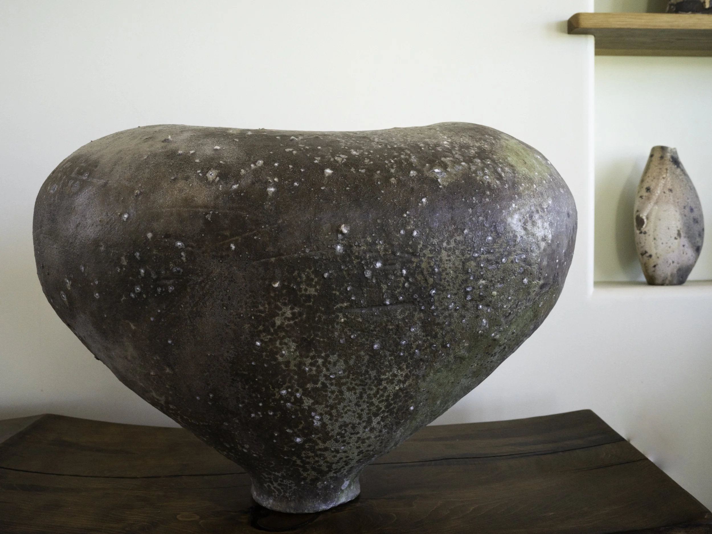 LOGAN WANNAMAKER  
Oval Orb (2025)  
22” x 14” x 12”  
Stoneware with local rock inclusions  
$2,800