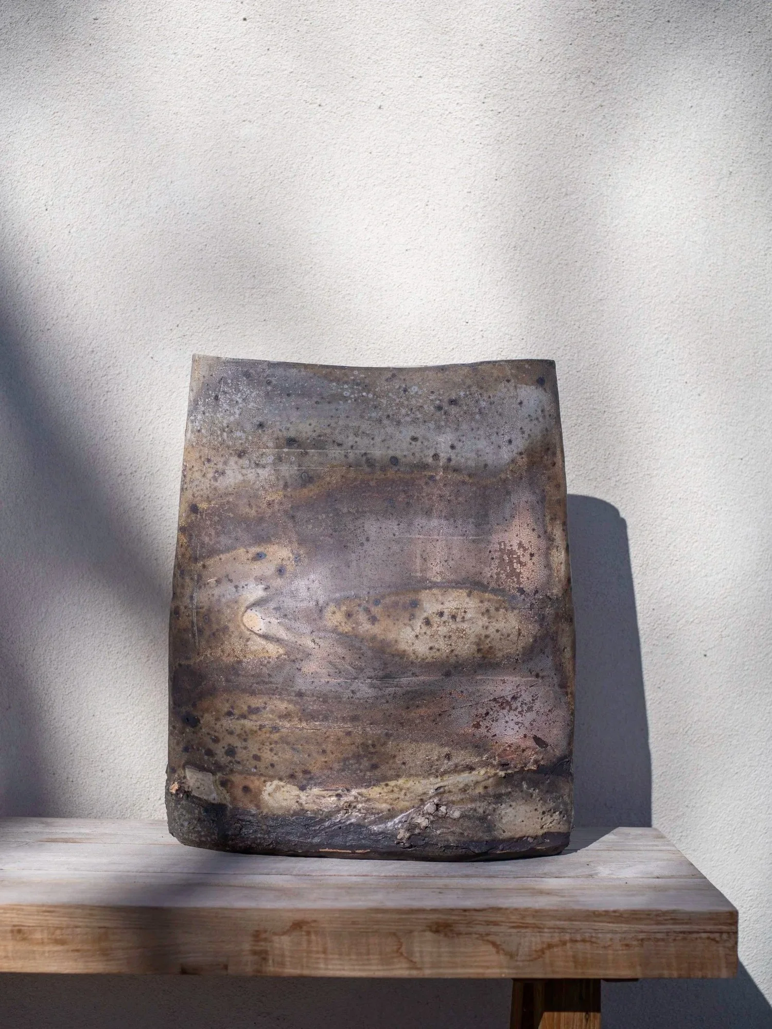 LOGAN WANNAMAKER  
Landscape Vase (2025)  
19” x 6” x 22”  
Black Abiquiu clay  
$4,200