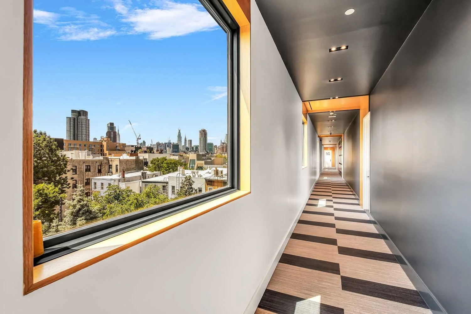 modern-nyc-building-corridor-skyline-view-unaevstudio.jpg