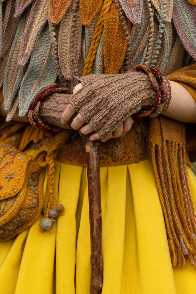 Raven Capelet, Sulaire Spencer, Sporran Bag, Breacan Wrap, and Ruabhal Gloves designs by Alice Starmore for Virtual Yarns. (if full length used) Boreray Dress fabric designed and made by Jade Starmore. Headpiece designed and made by Deniz Uster of Ot