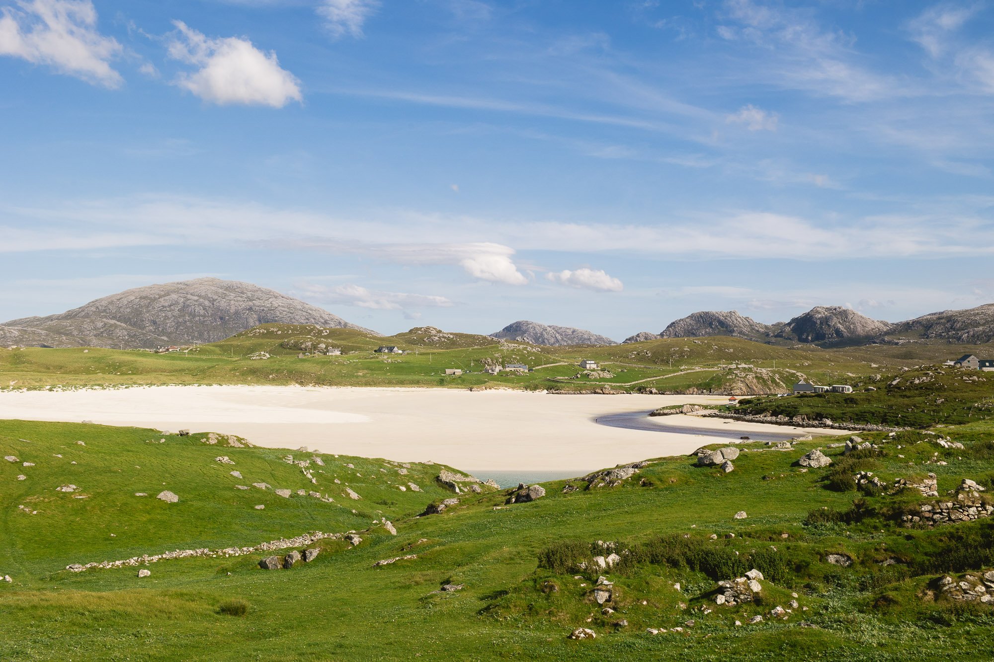 Views of croft, beach and hills in the background. Uig. 