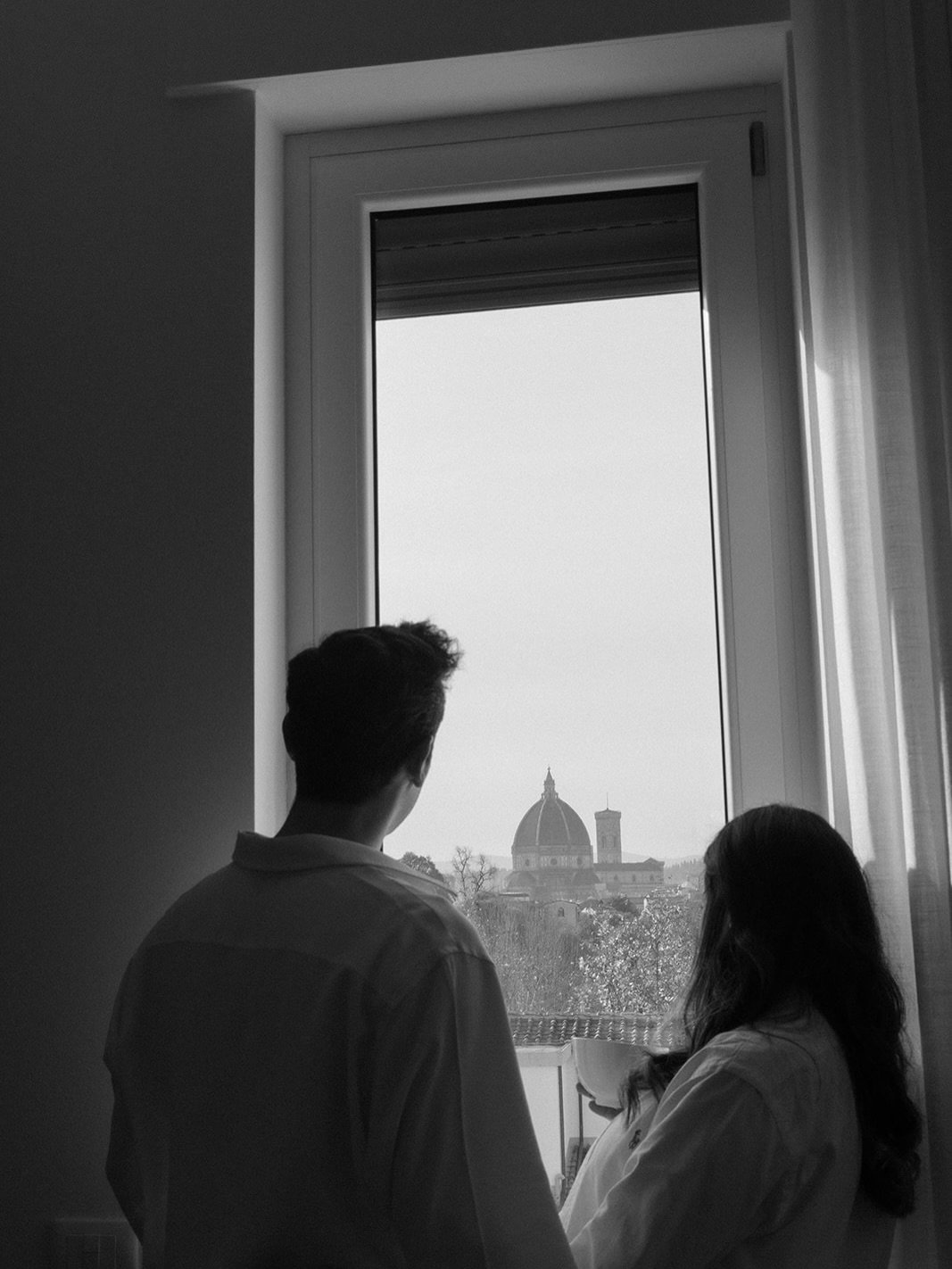 In the quiet heart of Florence, within a home washed in soft, effortless light, an in-love couple moves through the gentle rhythm of waiting. Their space becomes a refined sanctuary &mdash; intimate, understated, beautifully bare. A maternity story t