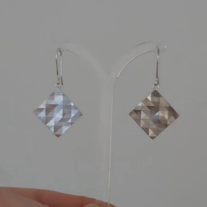 Making and taking photos of new jewellery pieces. Just a few of the things going on in the studio. These new square earrings and other pieces have just launched online.

#Facetedjewellery #geometricjewellery #contemporarysilverjewellery