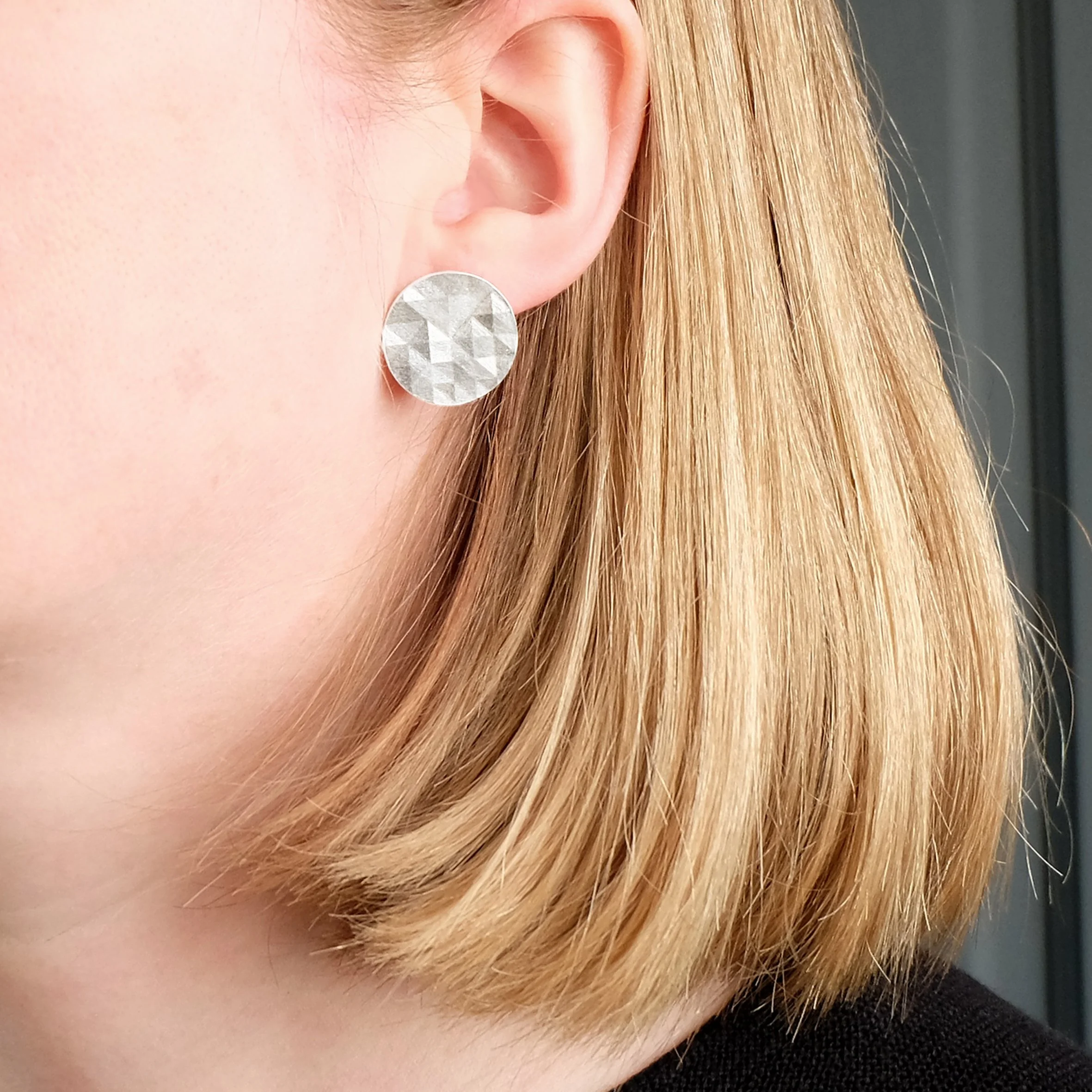 Large circular faceted earrings_worn.jpg