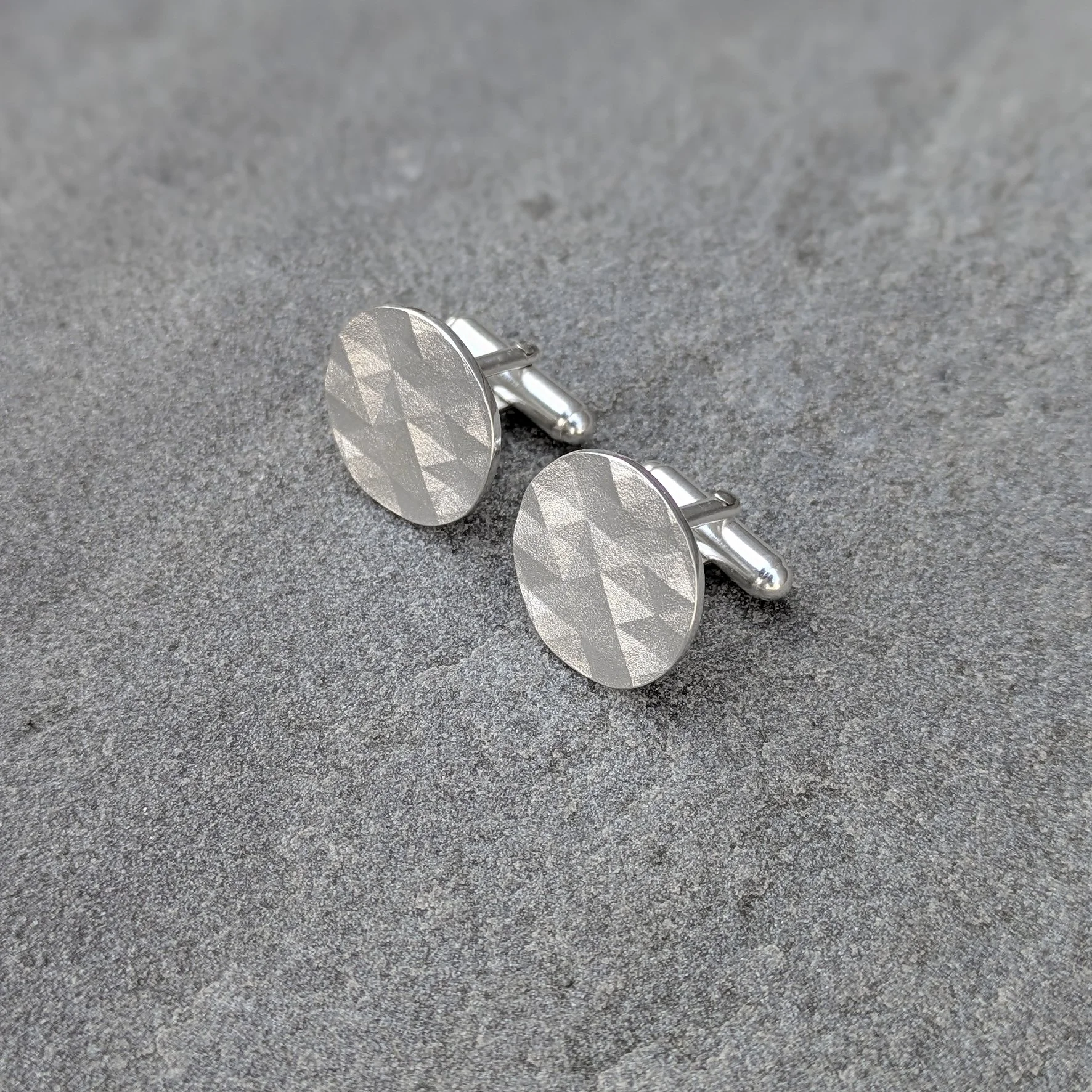 Kathryn Hinton_faceted round cufflink2_2026.jpg