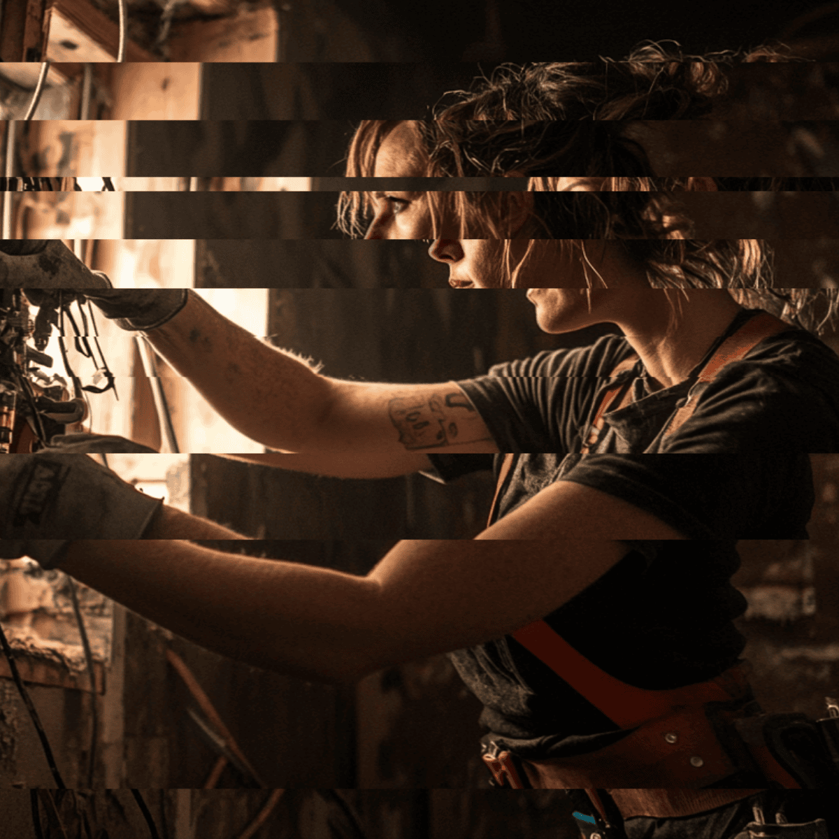 A glitching business woman with curly hair wearing a striped shirt and overalls working on electrical wires in a rustic workshop.