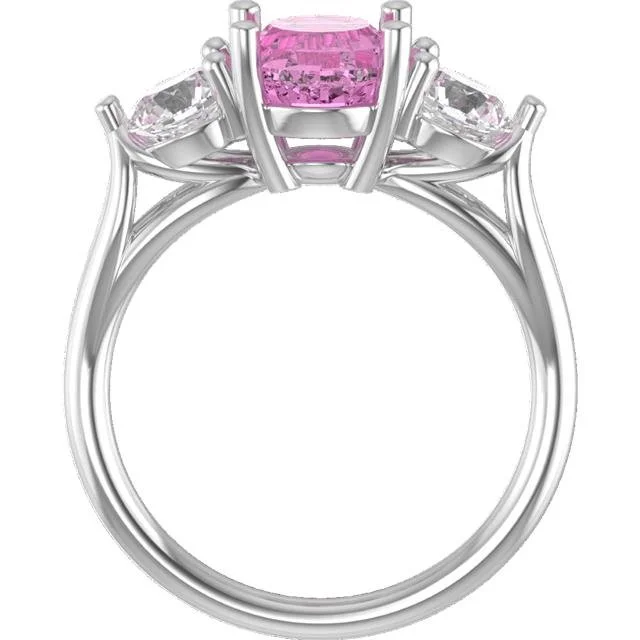 RE-designed ring to accommodate the original pink sapphire stone from her engagement ring. Two diamond earrings set on the sides to complement and a modified setting in platinum