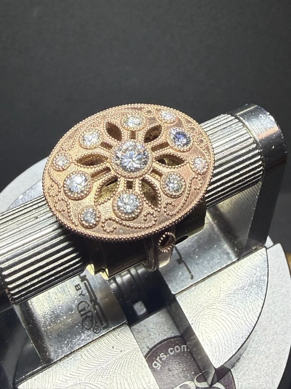 Custom Designed Rose Gold ring with milgrain, engraving and cutouts. We used the clients heritage diamonds.