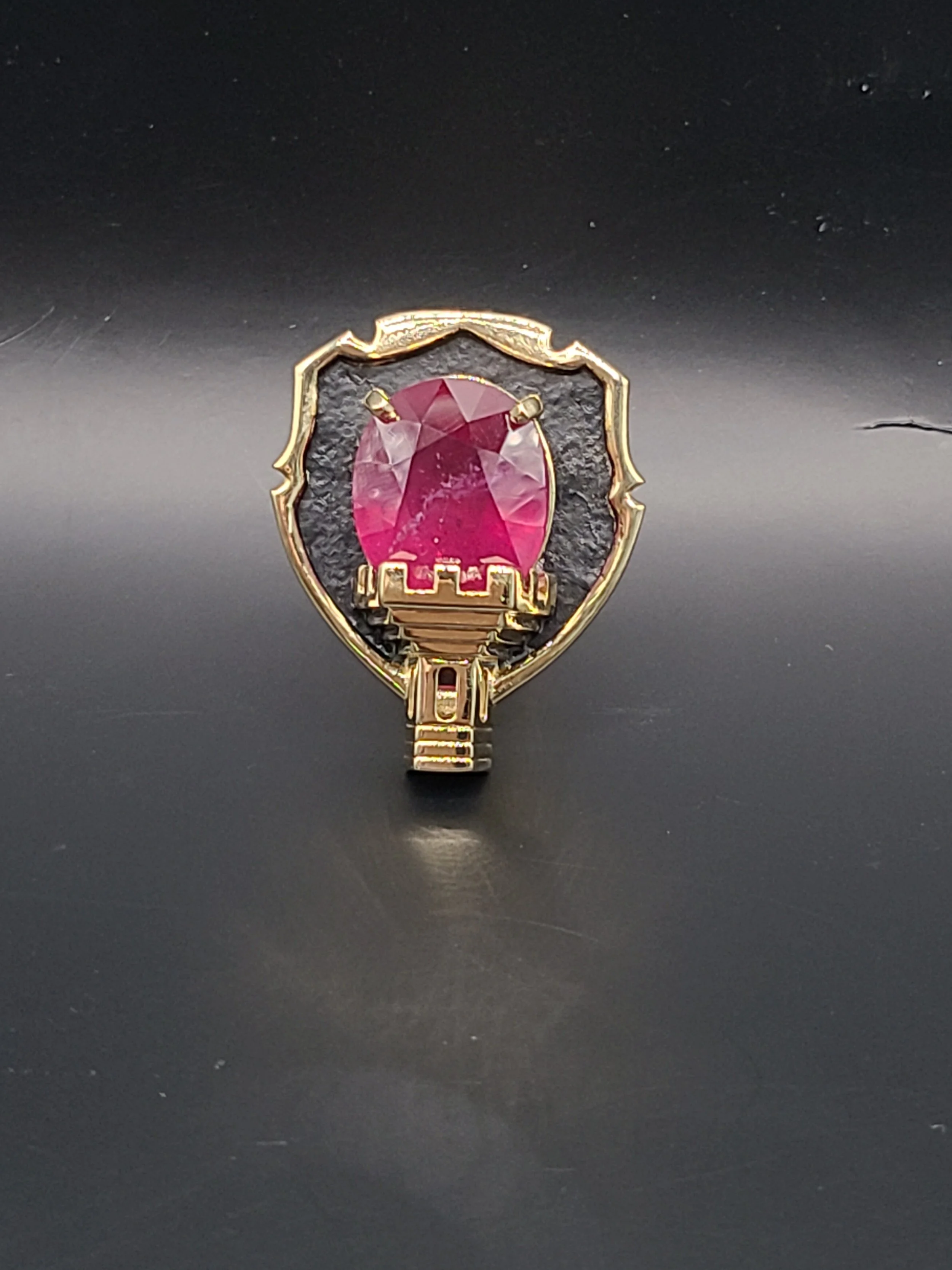 Custom designed tie tack with large ruby in yellow gold and silver