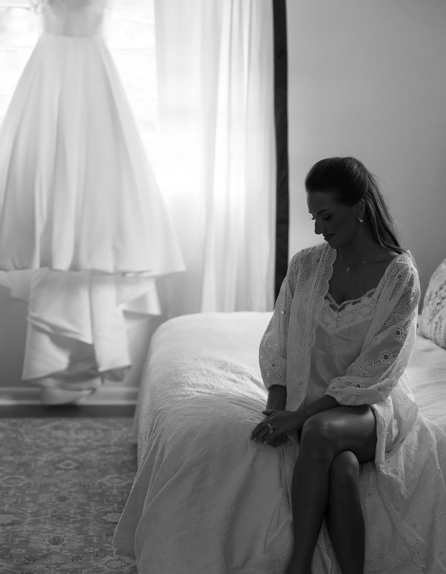 I feel like a black and white photo really captures the moment. Black and white photos have so much feeling to me. I love taking a moment on a wedding day and getting a bride to take a look at her dress. Yes it makes a beautiful photo but it also let