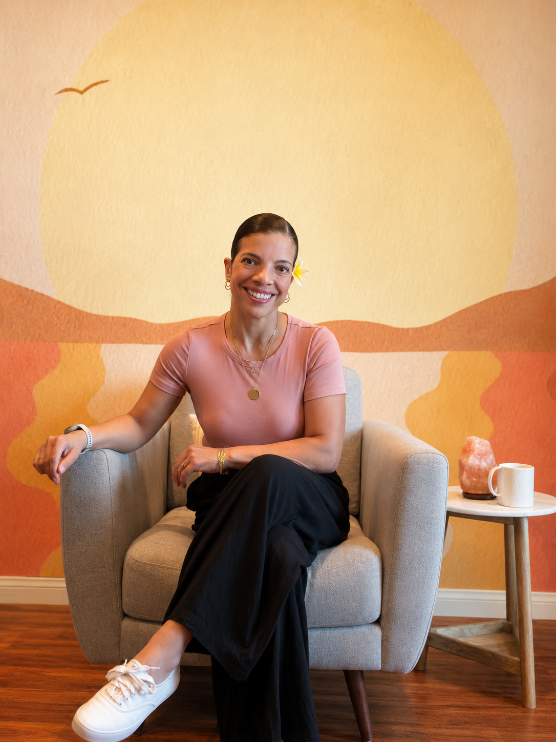 Koalani Lahr, LMFT, smiling while sitting in her therapy office.