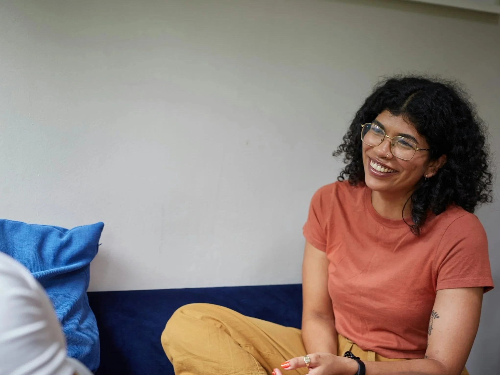 Perinatal mental health therapist talking with an adult client