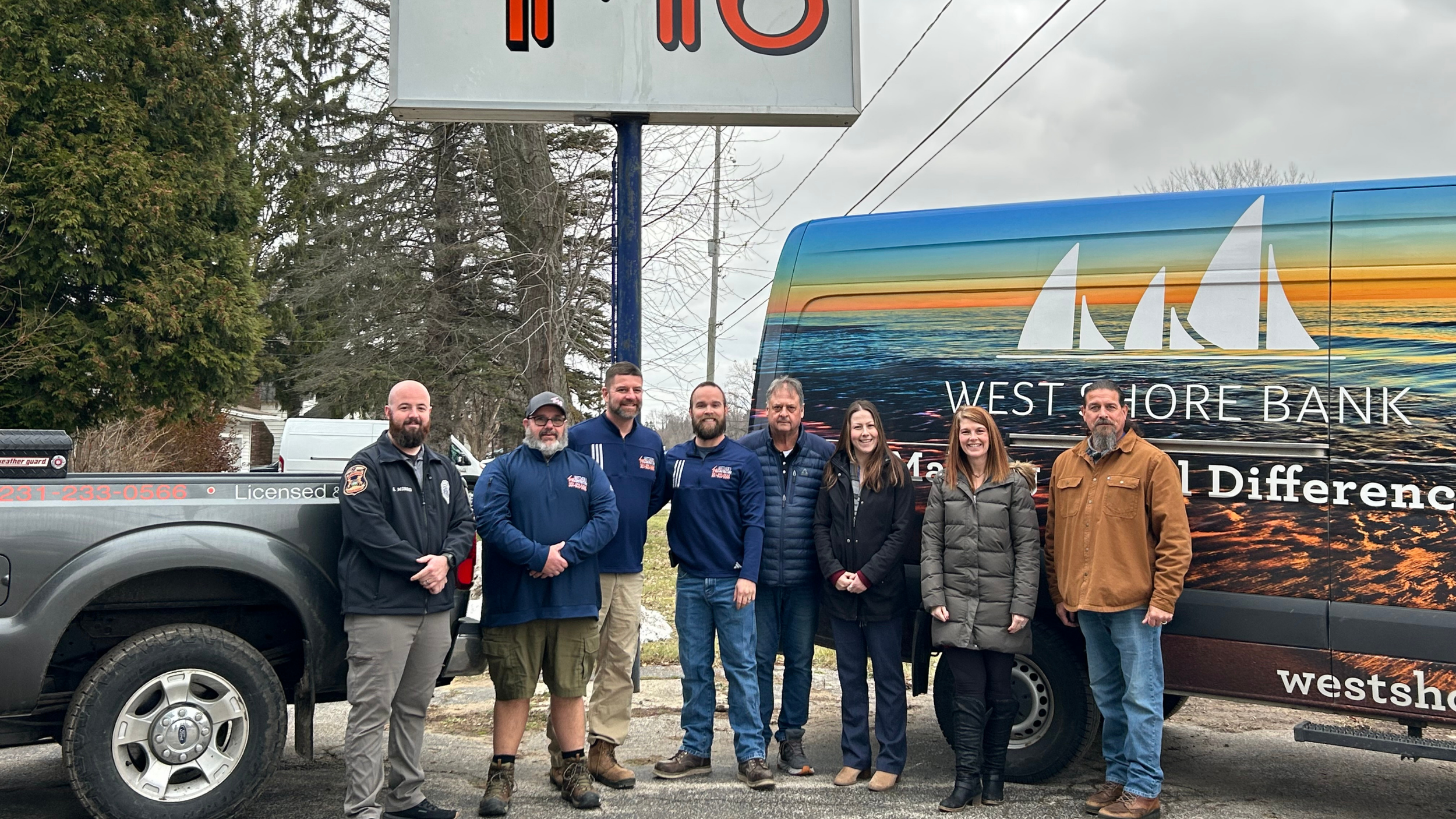 Supporting Pig for a Cause donation drive in Ludington, Michigan with West Shore Bank and Ludington Police Department