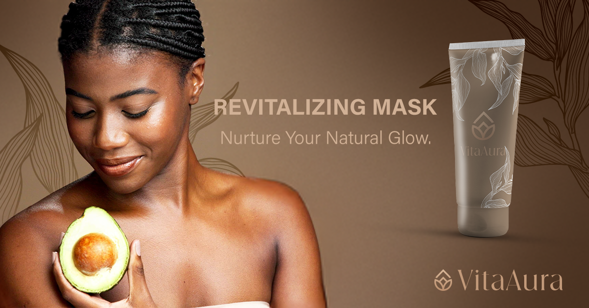 A woman with braids holding an avocado near her shoulder, looking down with a gentle smile. To her right, there is a tube of VitaAura revitalizing mask with a floral design in a gold and cream color scheme, against a warm, brown background with leaf patterns.