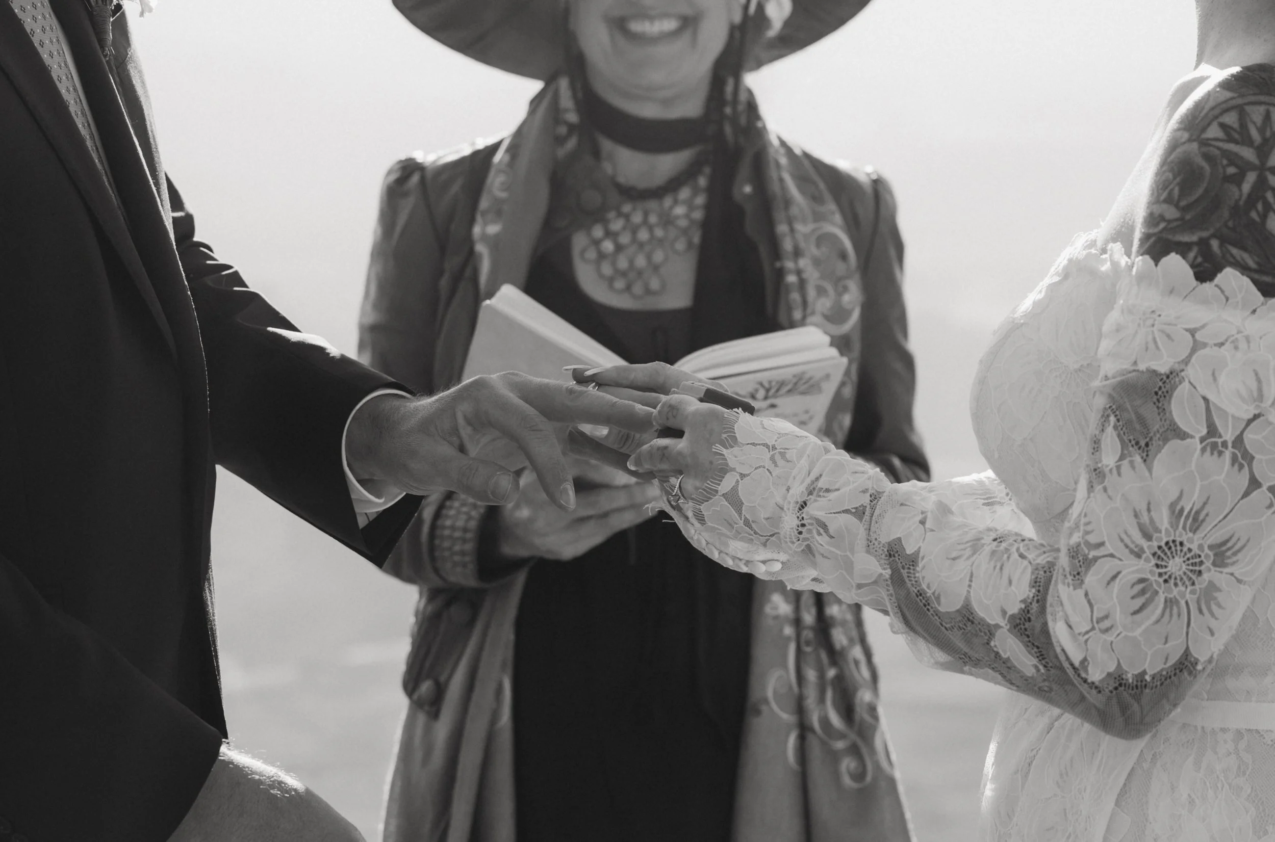 Moab wedding celebrant officiating ring exchange ceremony black and white