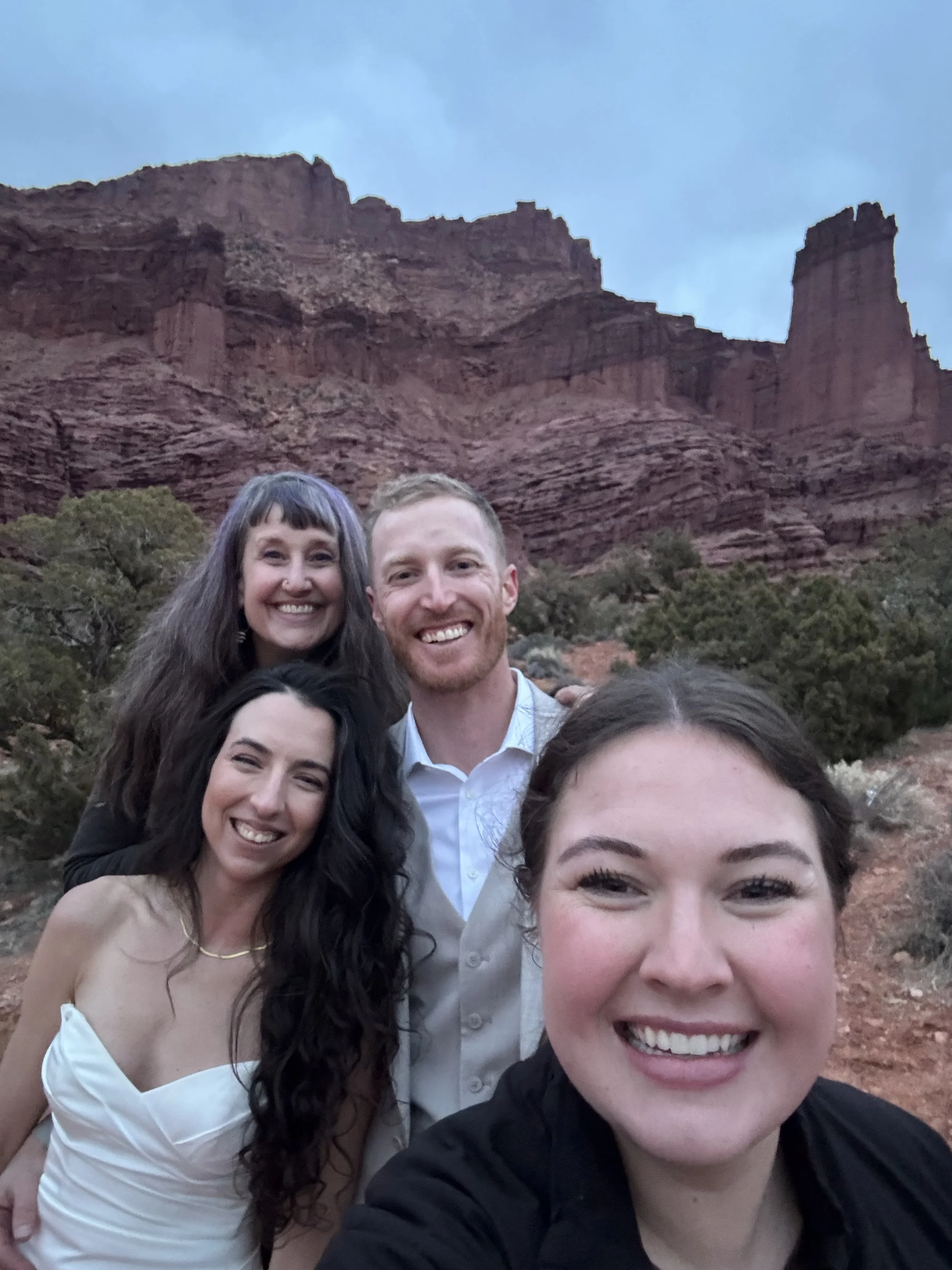 Happy clients after intimate wedding ceremony in Moab Utah red rock desert