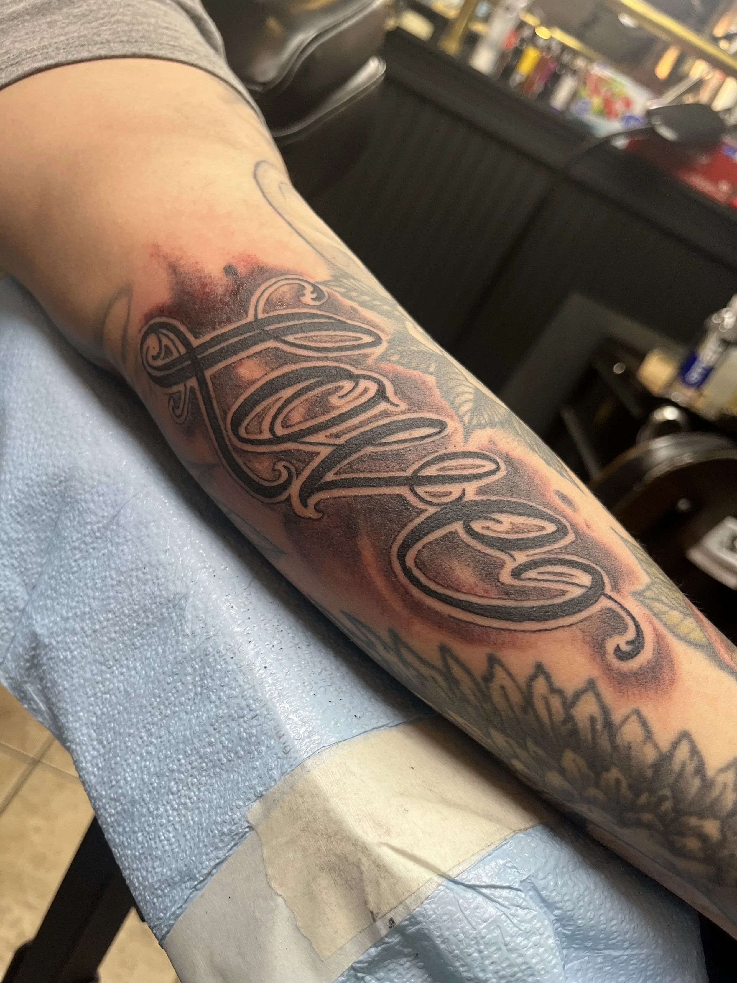 lettering black and grey tattoo
