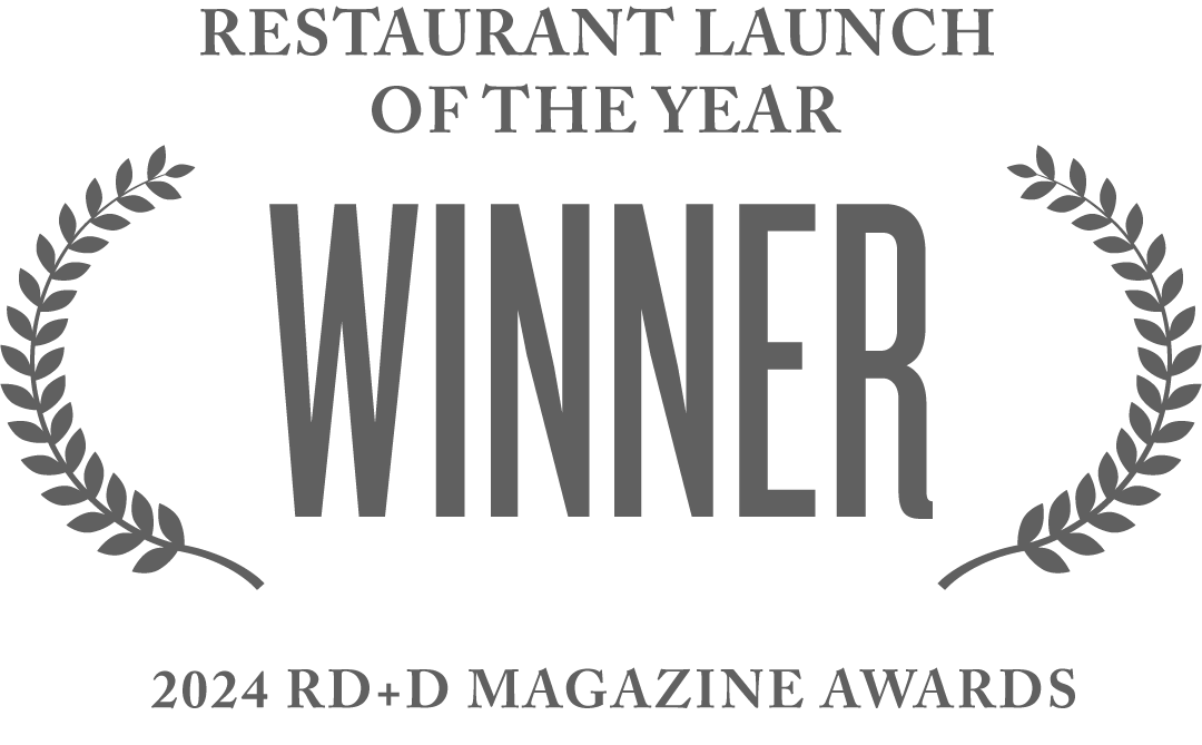 Award graphic with the words "Winner" and "Restaurant Launch of the Year" for the 2024 RD+D Magazine Awards, decorated with laurel wreaths.