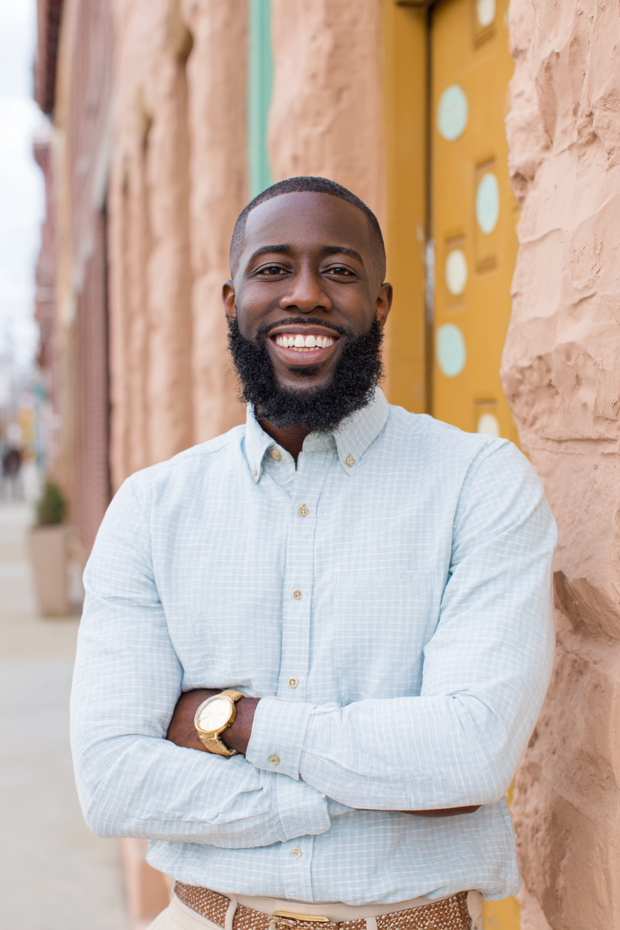 Portrait of a happy therapist on website for a practice branding expert.