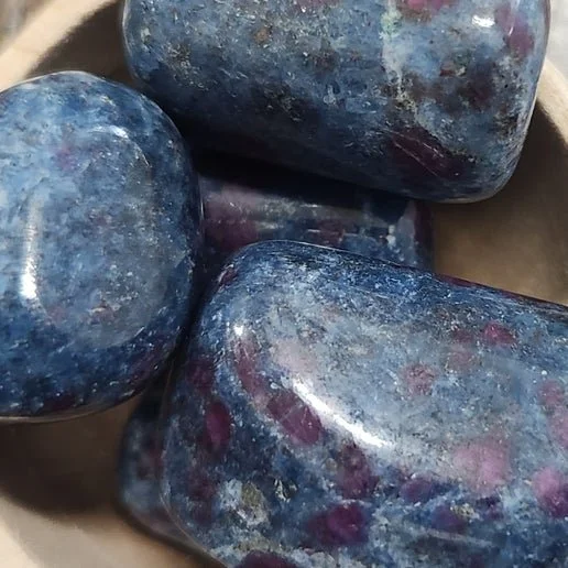 Ruby in Kyanite stone showing red ruby crystals within blue kyanite matrix used for balanced passion and clear communication.