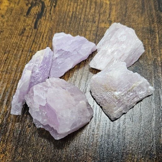 Soft pink Kunzite crystal shown in rough and polished forms with delicate translucent structure.