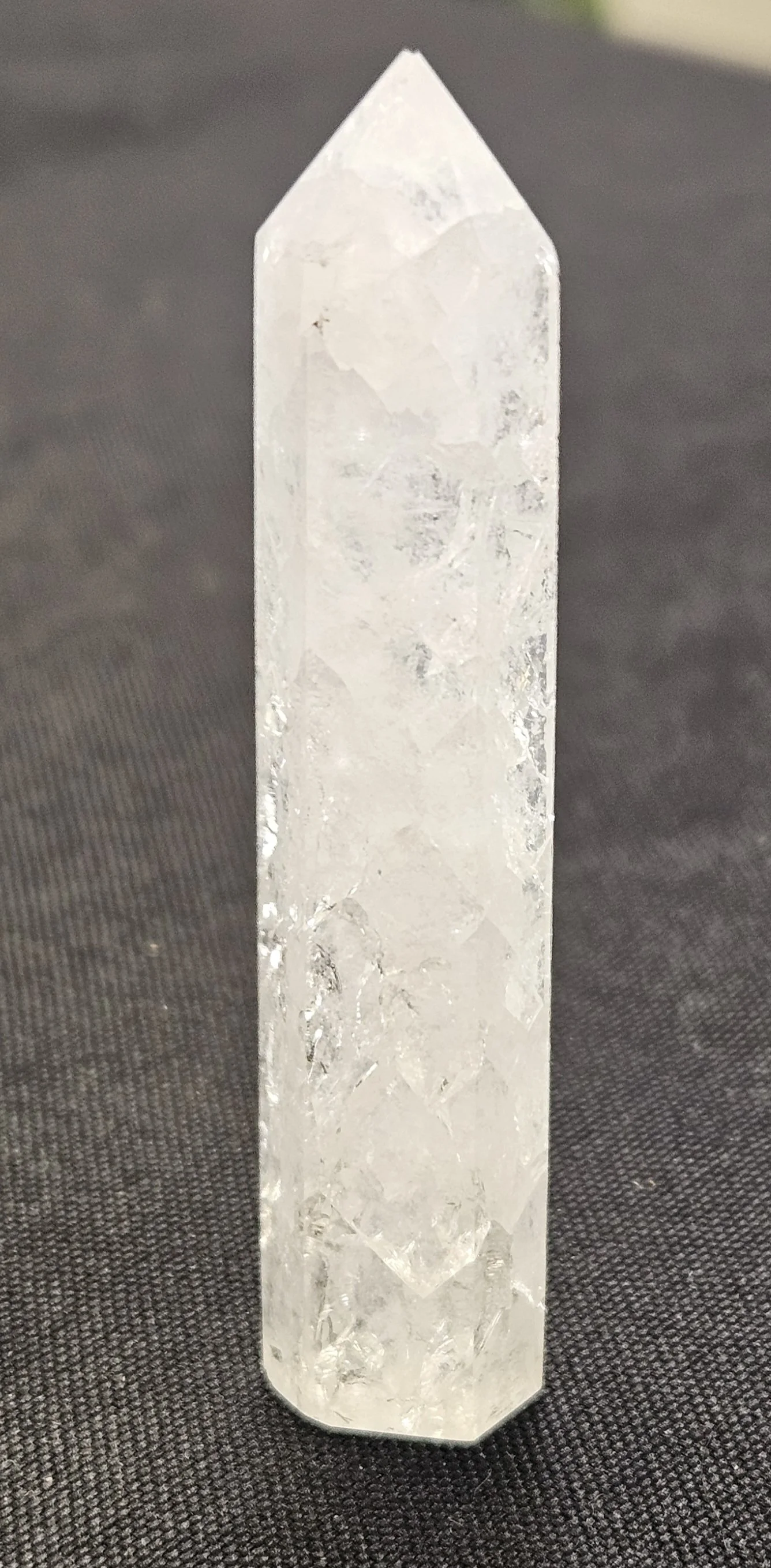 Fire and Ice Quartz crystal showing internal fractures and rainbow reflections used for transformation, clarity, and high-vibration spiritual practices