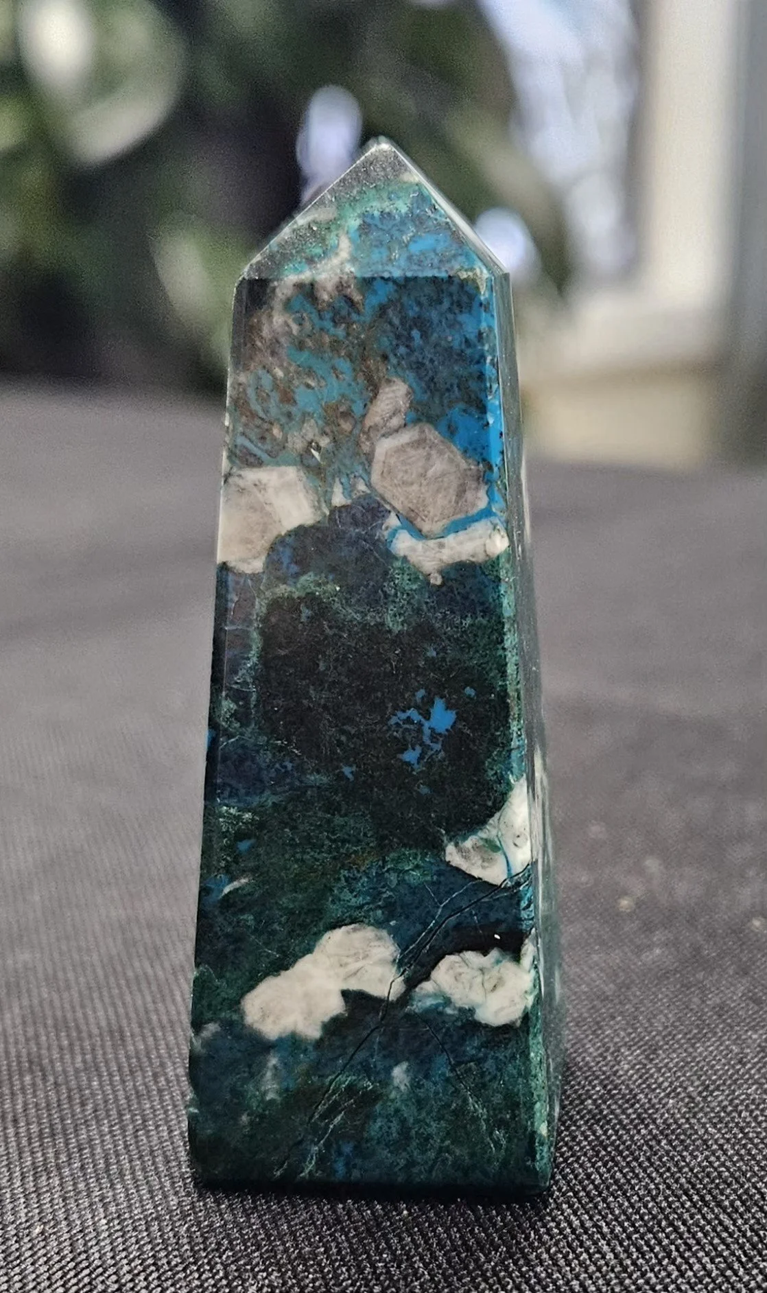 Chrysocolla stone displaying rich blue and green tones with natural copper-based patterns and a soothing, polished appearance.