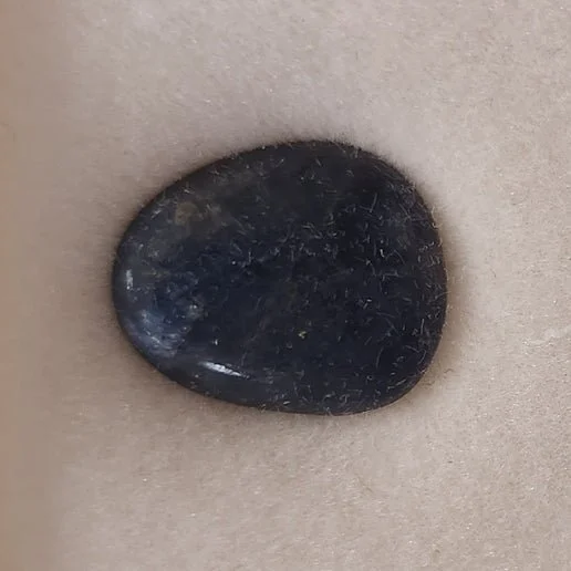 Blue, pink, yellow, and star sapphire gemstones displayed showing polished and cabochon varieties with vibrant colour and natural brilliance.