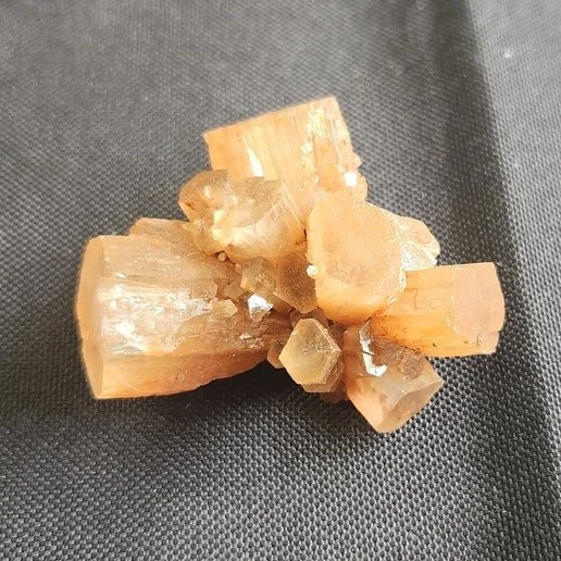 Brown Aragonite crystal with earthy brown tones and natural clustered formation, showing a grounding and organic mineral texture.