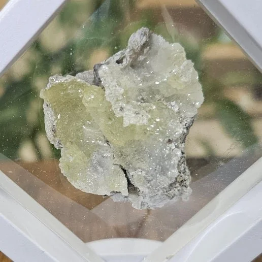 Golden Brucite crystal specimen displaying vibrant yellow to golden crystal formations on natural stone matrix.