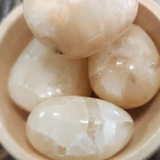 Peach and pink Stilbite crystal cluster with delicate layered formations on natural matrix.