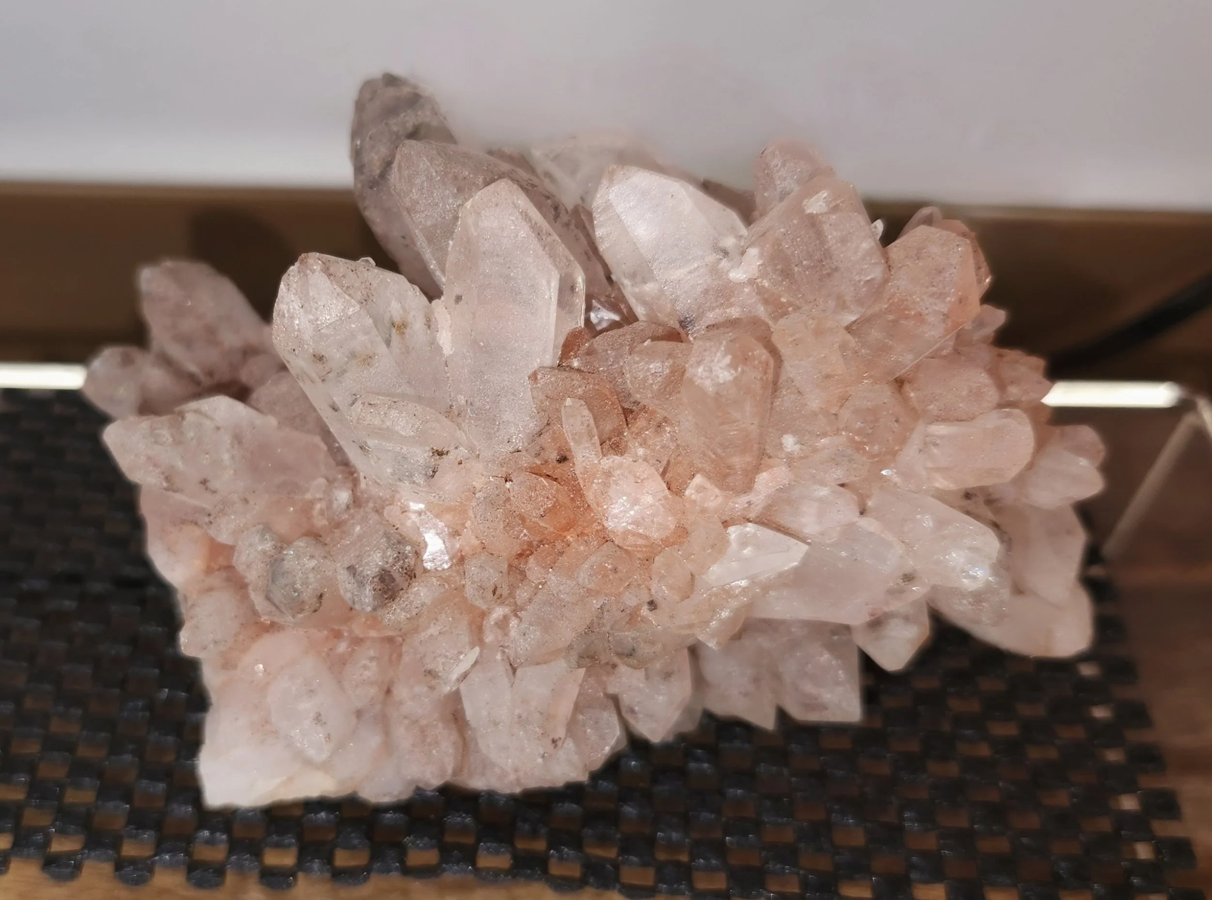 Natural Pink Himalayan Quartz crystal point with soft blush inclusions used for heart chakra healing and spiritual connection.